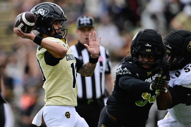 Colorado Buffaloes quarterback Julian Lewis passes the ball during the Black and Gold spring football game at Folsom Field in Boulder on Saturday, April 11, 2026. (Matthew Jonas/Staff Photographer)
