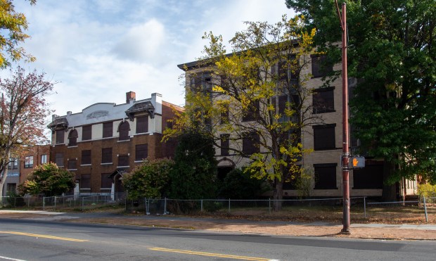 Two of the three buildings at the northeast corner of Washington and Jefferson streets that Hartford Hospital plans to combine into one new medical office, The facades of the 1920s structures will be saved in the project. (Aaron Flaum/Hartford Courant)