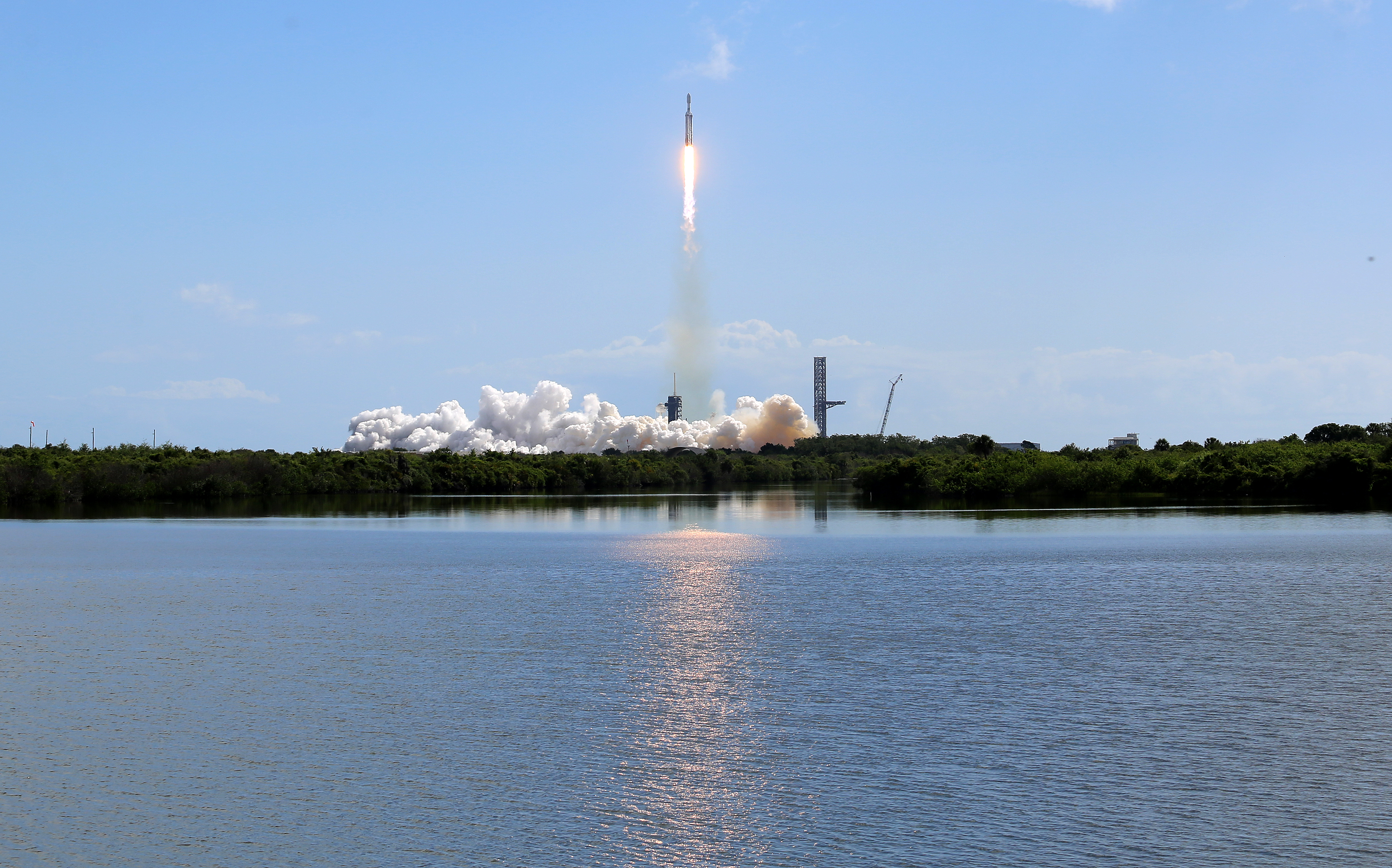 A SpaceX Falcon Heavy rocket launches from Kennedy Space Center's...