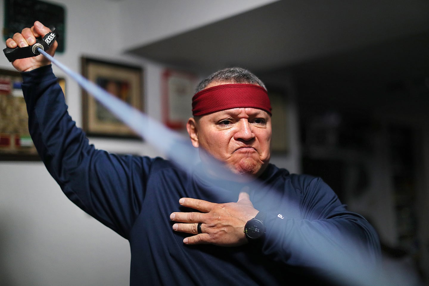 Marine Corps veteran Al Tenorio, 60, worked out in his basement gym. During his 30-year military career, he served in Afghanistan and Iraq and suffers PTSD and other mental and physical conditions.