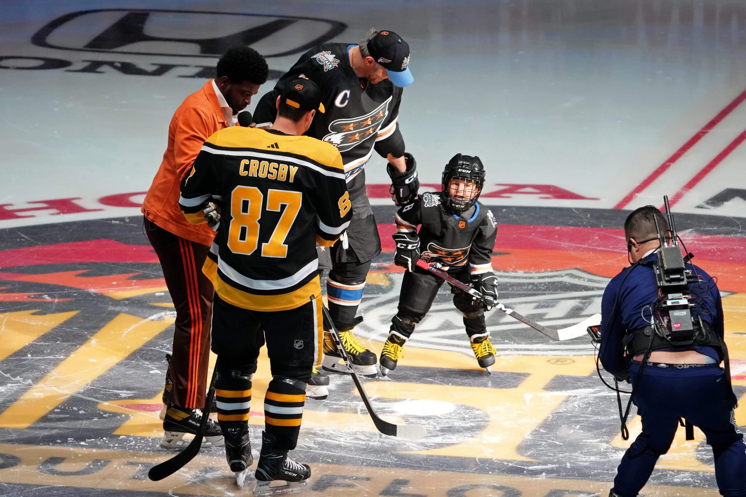 Crosby, Ovechkin, Sergei and Subban gather around center ice before a shootout competition