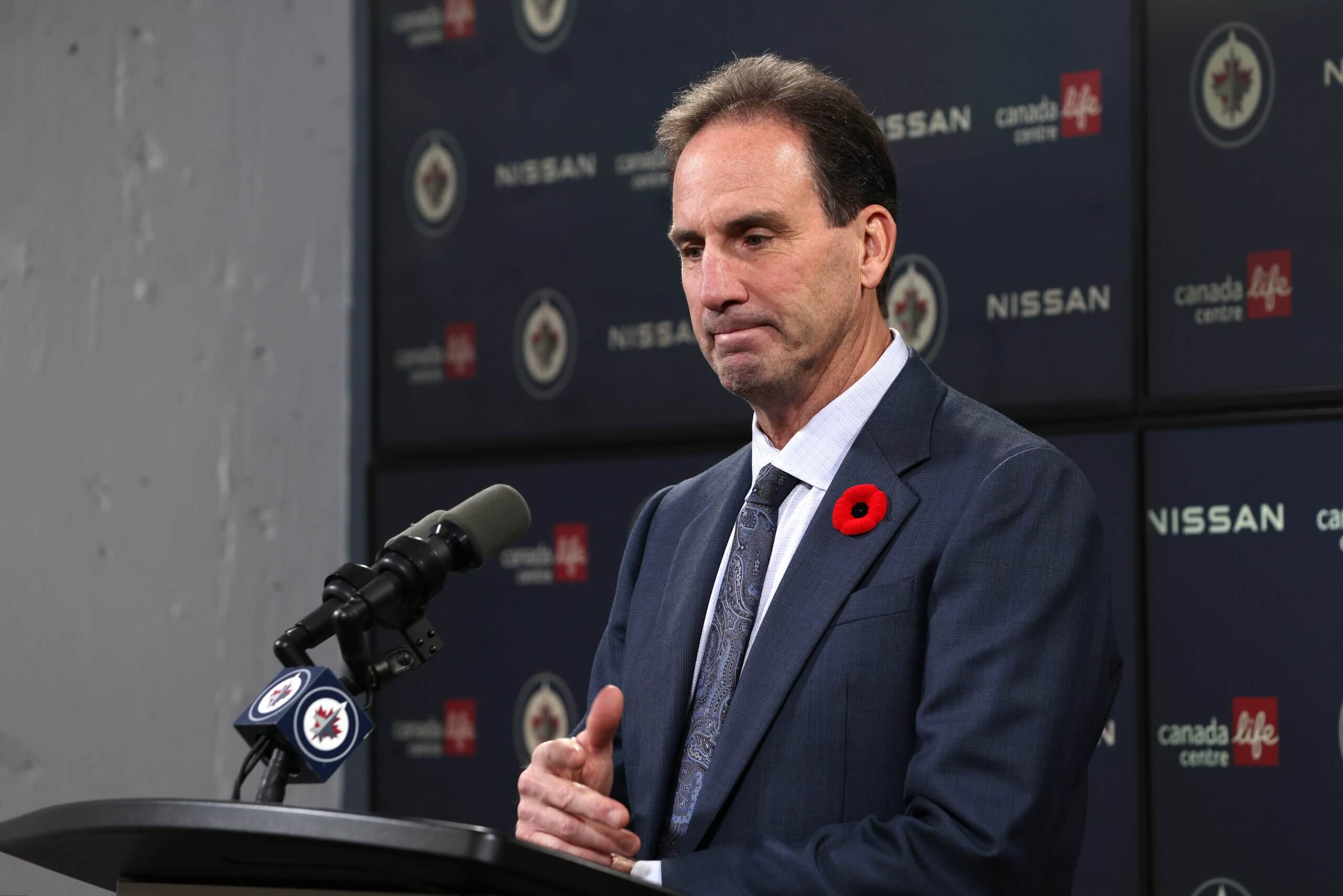 Jets coach Scott Arniel talks to media members after a win. 