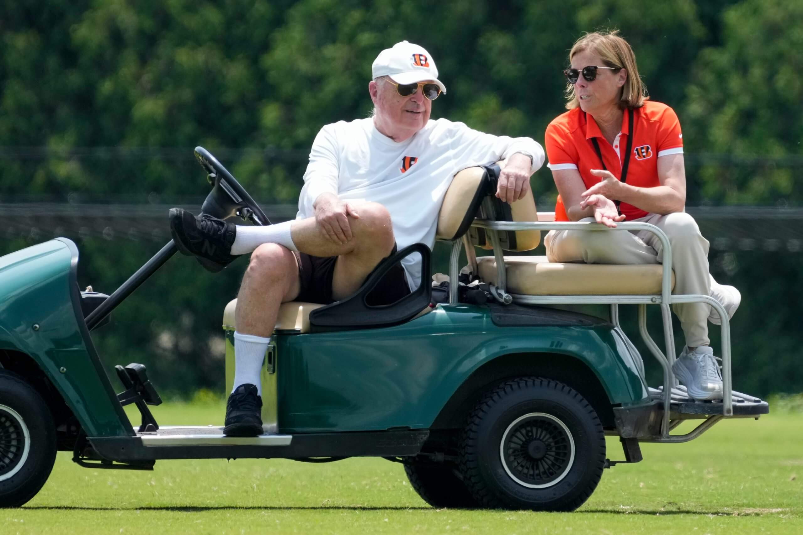 Cincinnati Bengals executives Mike Brown and his daughter Katie Blackburn talk on the sideline during a session of organized team activities on the Bengals practice field at Paycor Stadium in downtown Cincinnati on Tuesday, June 3, 2025.