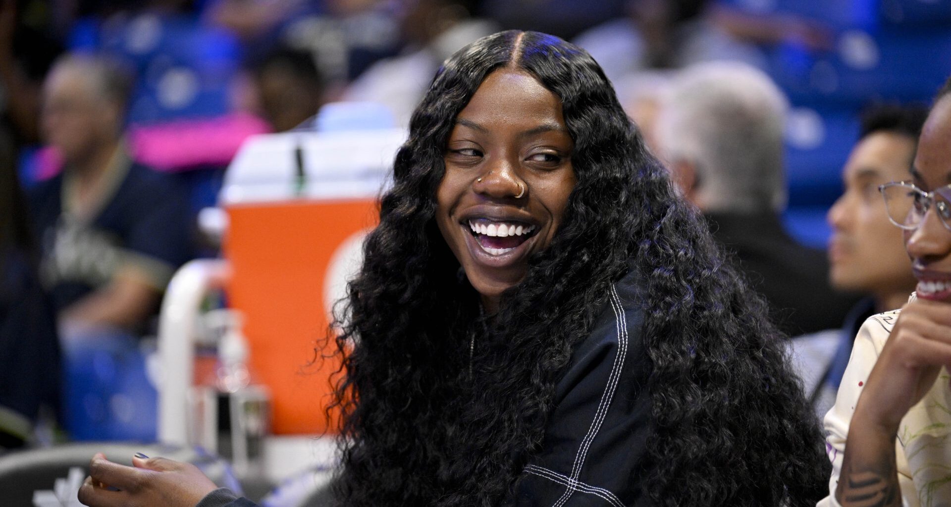 Aug 27, 2025; Arlington, Texas, USA; Dallas Wings guard Arike Ogunbowale (24) looks on from the team bench during the first half against the Connecticut Sun at College Park Center.