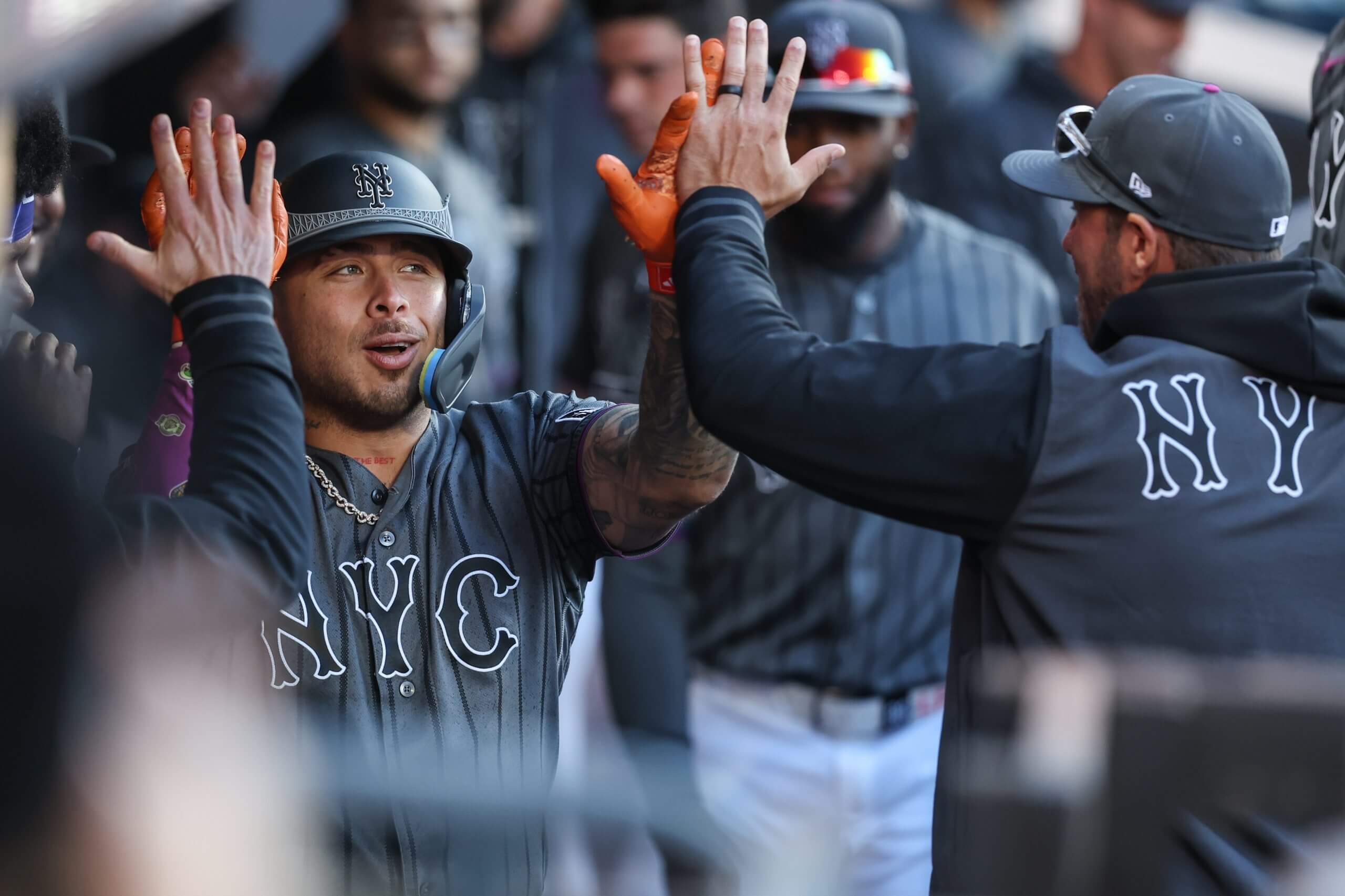 Francisco Alvarez is greeted in the dugout after hitting a home run.