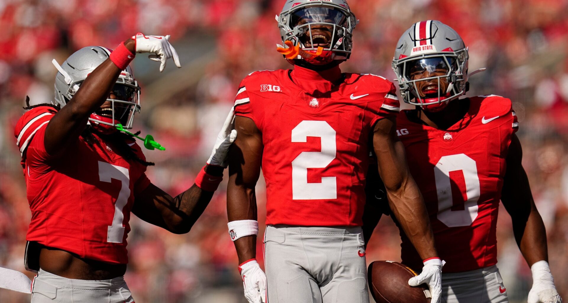 Ohio State Buckeyes safety Caleb Downs (2) celebrates an interception with cornerback Jermaine Mathews Jr. (7) abnd linebacker Sonny Styles (0) during the first half of the NCAA football game against the Grambling State Tigers at Ohio Stadium on Sept. 6, 2025.