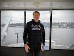 Greg Holloway gives a tour of the luxury yacht he owns and charters out to customers with Seattle's Lake Union in the background.