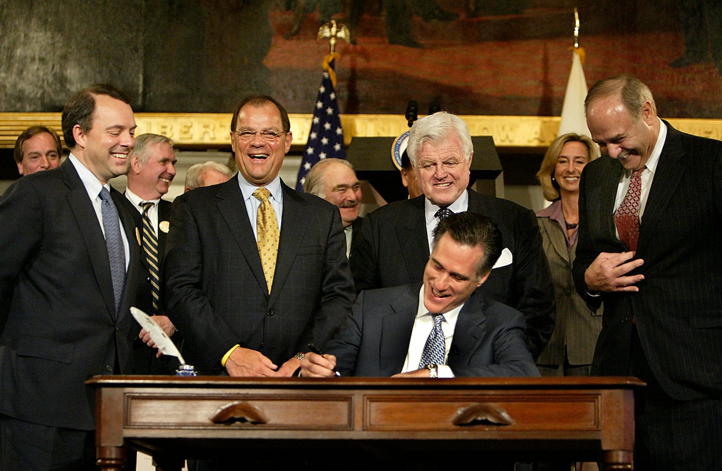 Mitt Romney, then governor of Massachusetts, signed a landmark health care reform bill into law at Faneuil Hall on April 12, 2006.