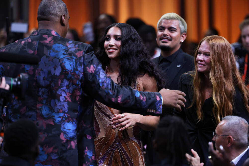 UConn guard Azzi Fudd hugs her family after being selected first overall by the Dallas Wings in the first round of the WNBA basketball draft Monday, April 13, 2026, in New York. (Pamela Smith/AP)