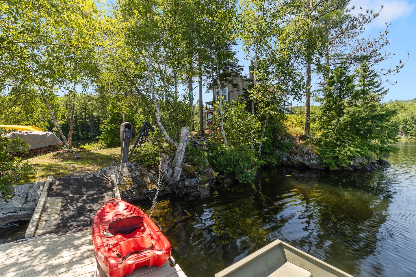 The dock and a boat at 1 Nay Pond Island.