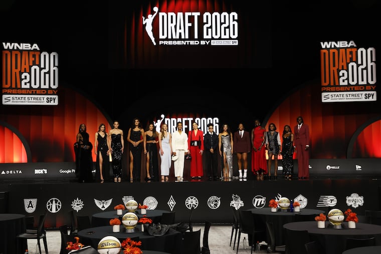Players pose on stage before the WNBA draft on Monday in New York.