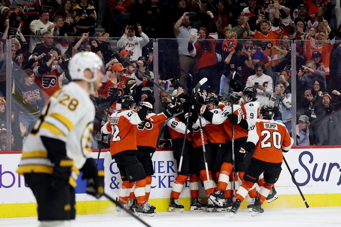 The Flyers celebrate Porter Martone's first career goal, which gave Philadelphia a 2-1 overtime win over the Bruins on Sunday.