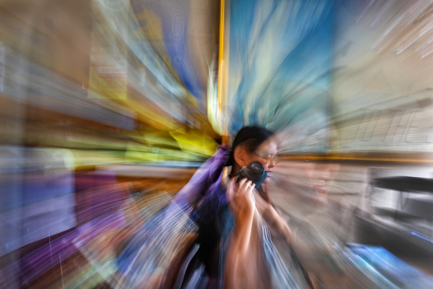 Tina Zhu Xi Caruso, 27, a functionally blind photographer, downloads images from her camera in Quincy. "Half the time I see faces, but I don't see expressions on faces," says Caruso, a disability advocate. "So I see you, but half the time I just see blobs of color for faces."