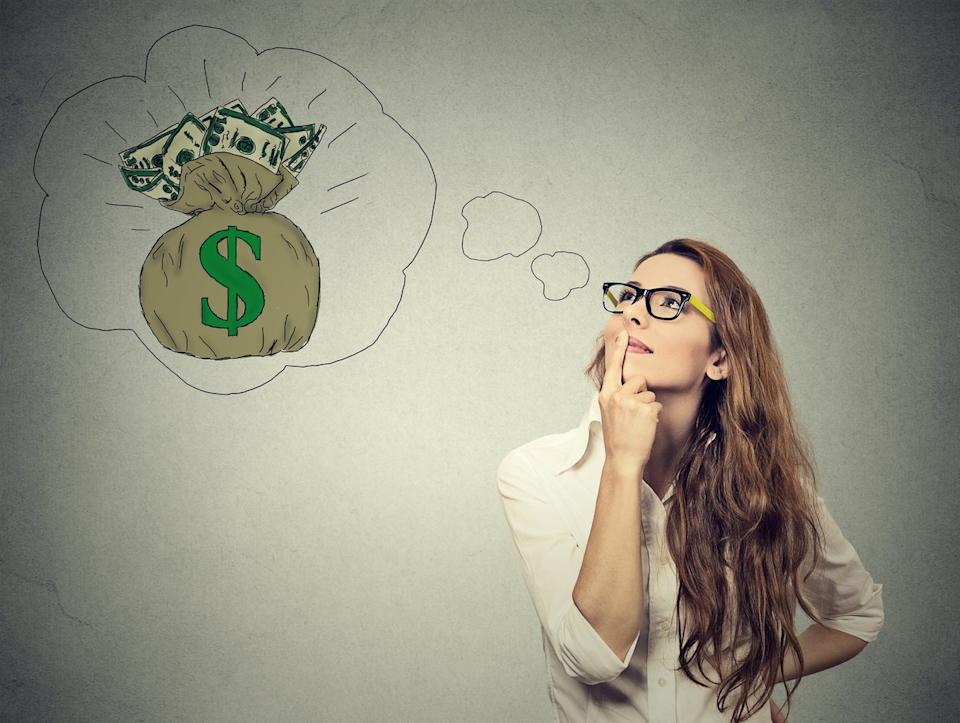 A person wearing glasses looks at a thought bubble with a bag of money inside it.