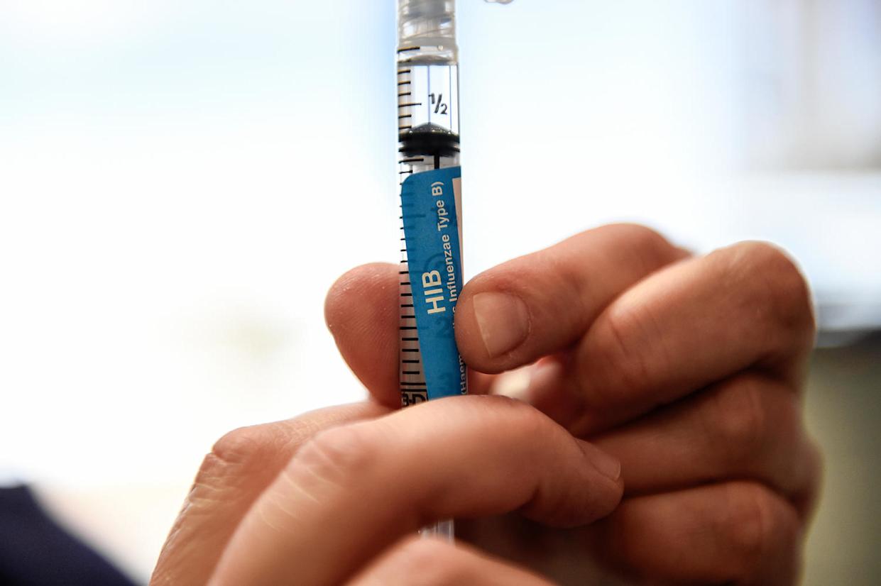 A detail of a syringe containing an Hib vaccine. (Joe Amon / The Denver Post via Getty Images file)