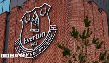 An Everton emblem seen on the exterior of the Hill Dickinson Stadium before the Premier League match between Everton and Tottenham Hotspur at Hill Dickinson Stadium