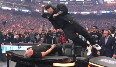 Jelly Roll Smashes Pat McAfee Through a Table at WrestleMania