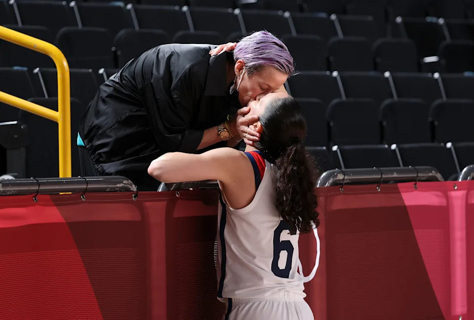 Megan Rapinoe kisses her fiancee Sue Bird on day sixteen of the Tokyo 2020 Olympic Games at Saitama Super Arena on August 8, 2021.