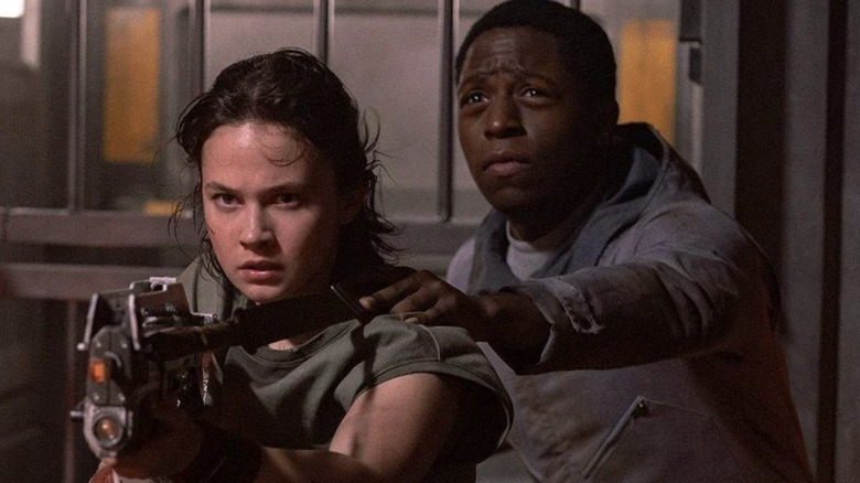 David Jonsson as Andy the andriod holding on to Cailee Spaeny as Marie Raines 