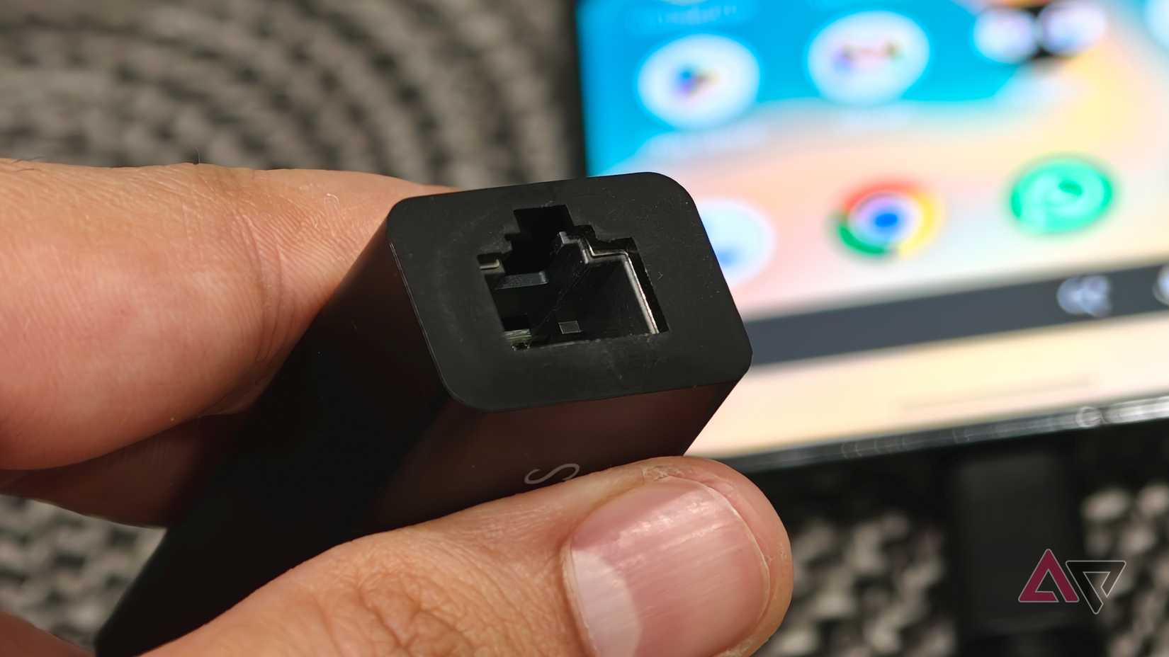 Close-up of USB-to-Ethernet adapter port used with Android phone