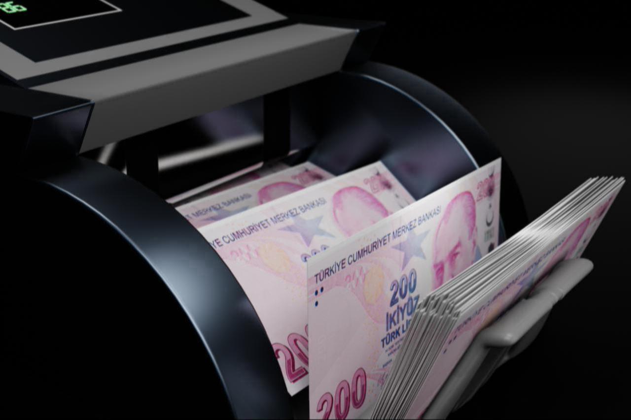 Illustration shows bundles of 200 Turkish lira banknotes being counted in a money-counting machine, date and time undisclosed. (Adobe Stock Photo)