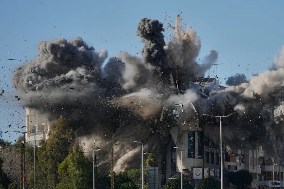 Smoke rises after an Israeli airstrike hits a building in Beirut.