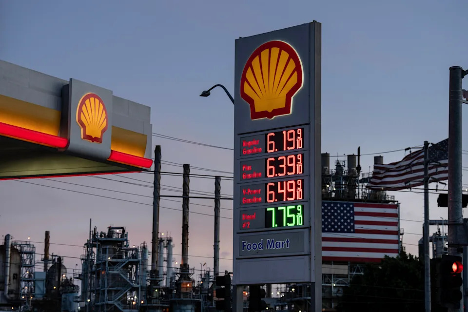 Gas prices are displayed at a Shell gas station near a refinery. The costs range from $6.19 for regular to $7.75 for diesel.