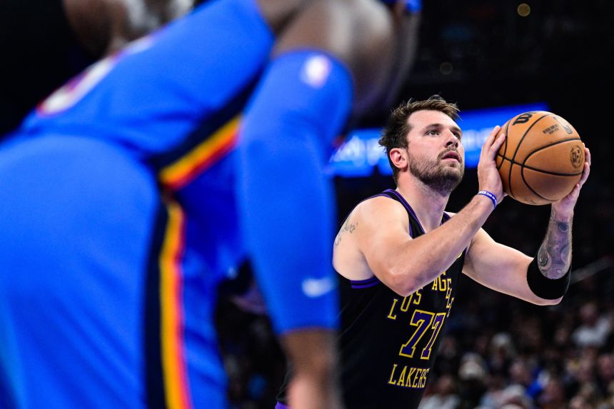 Dončić (77) shoots a free throw during the first half of an NBA basketball game against the Oklahoma City Thunder Thursday, April. 2, 2026, in Oklahoma City.