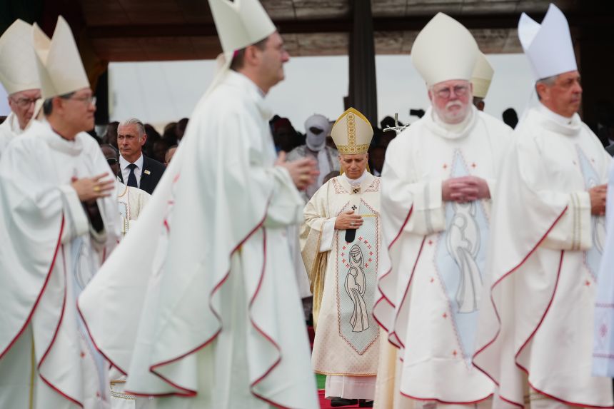 Pope Leo XIV arrives in procession with cardinals and bishops to celebrate Mass at Yaounde Ville Airport, Cameroon, on Saturday, April 18, on the sixth day of his 11-day pastoral visit to Africa.