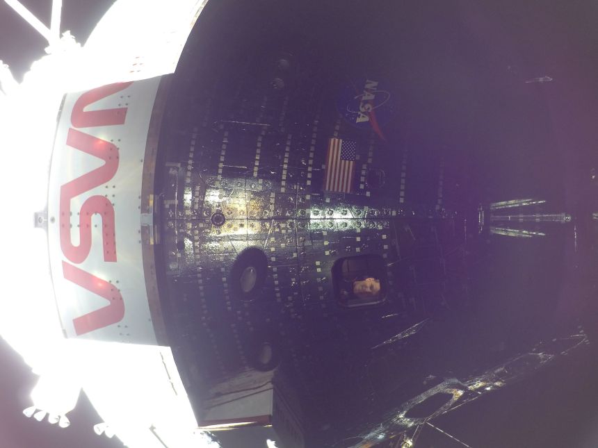 Canadian Space Agency astronaut Jeremy Hansen is seen through a window of the Orion spacecraft while en route to the moon on day 4 of the Artemis II mission. The