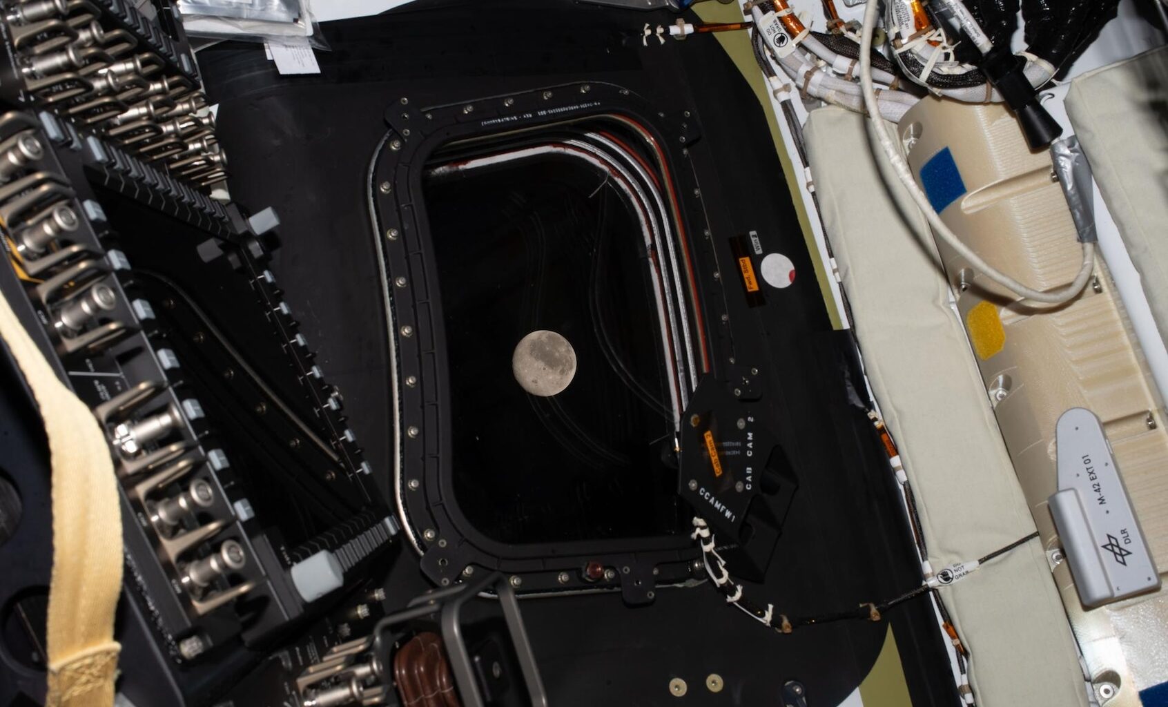 The Artemis II crew snapped a photo of the moon as it drew close in the window of the Orion spacecraft on April 6, 2026. (Image Credit: NASA)