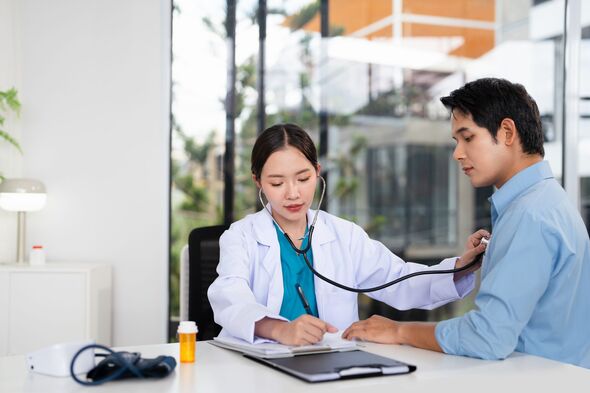 Asian doctor talk with patient about disease symptom, doctor use stethoscope listening lung of patient, health check up. Asian doctor talk with patient about disease symptom, doctor use stethoscope listening lung of patient, health check up.