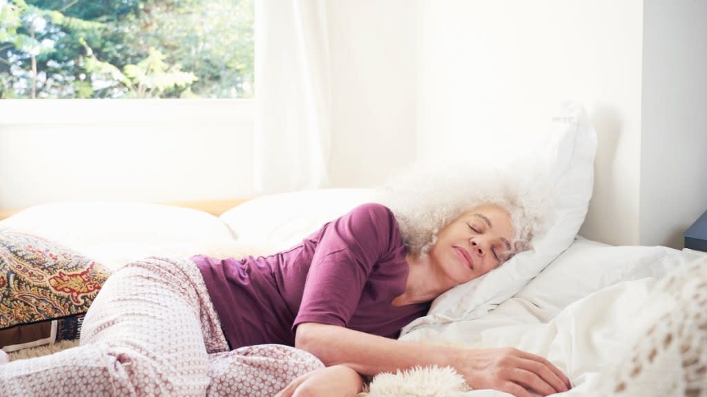 Woman sleeping on her left side