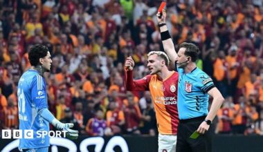 Referee Yasin Kol shows a red card to goalkeeper Ederson