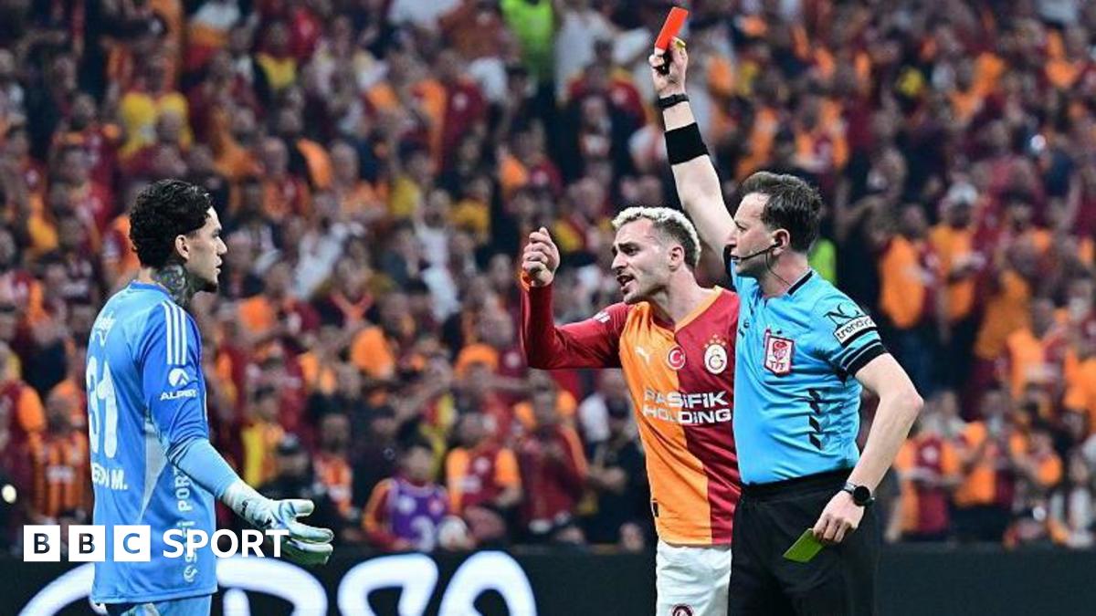 Referee Yasin Kol shows a red card to goalkeeper Ederson