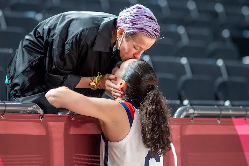 Megan Rapinoe kisses her fiancee Sue Bird on day sixteen of the Tokyo 2020 Olympic Games at Saitama Super Arena on August 8, 2021.