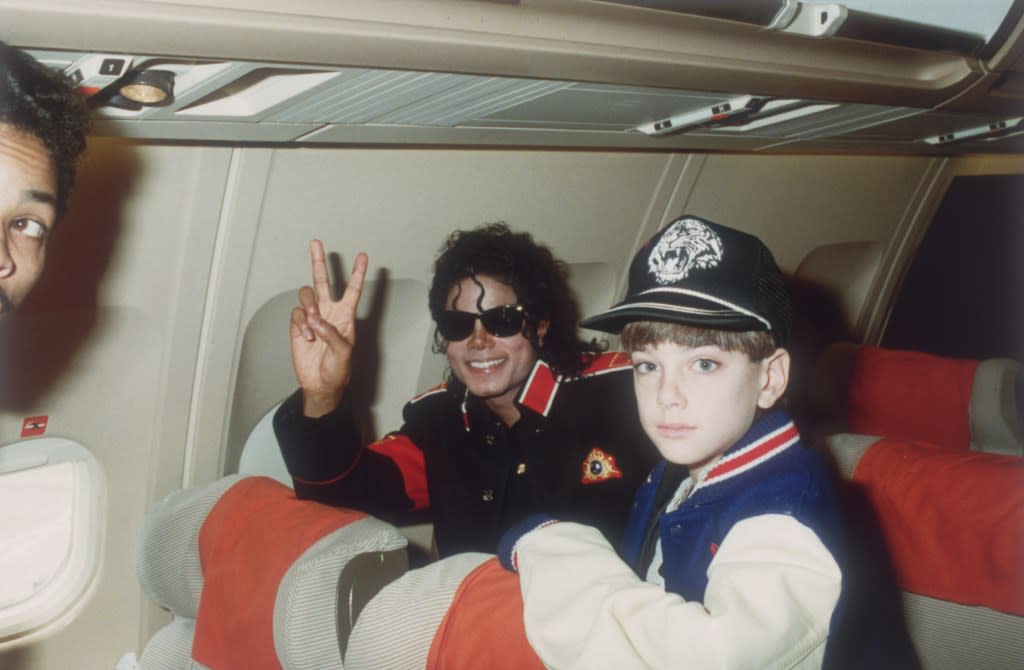 Michael Jackson with 10-year-old James Safechuck on a tour plane in 1988. Getty Images