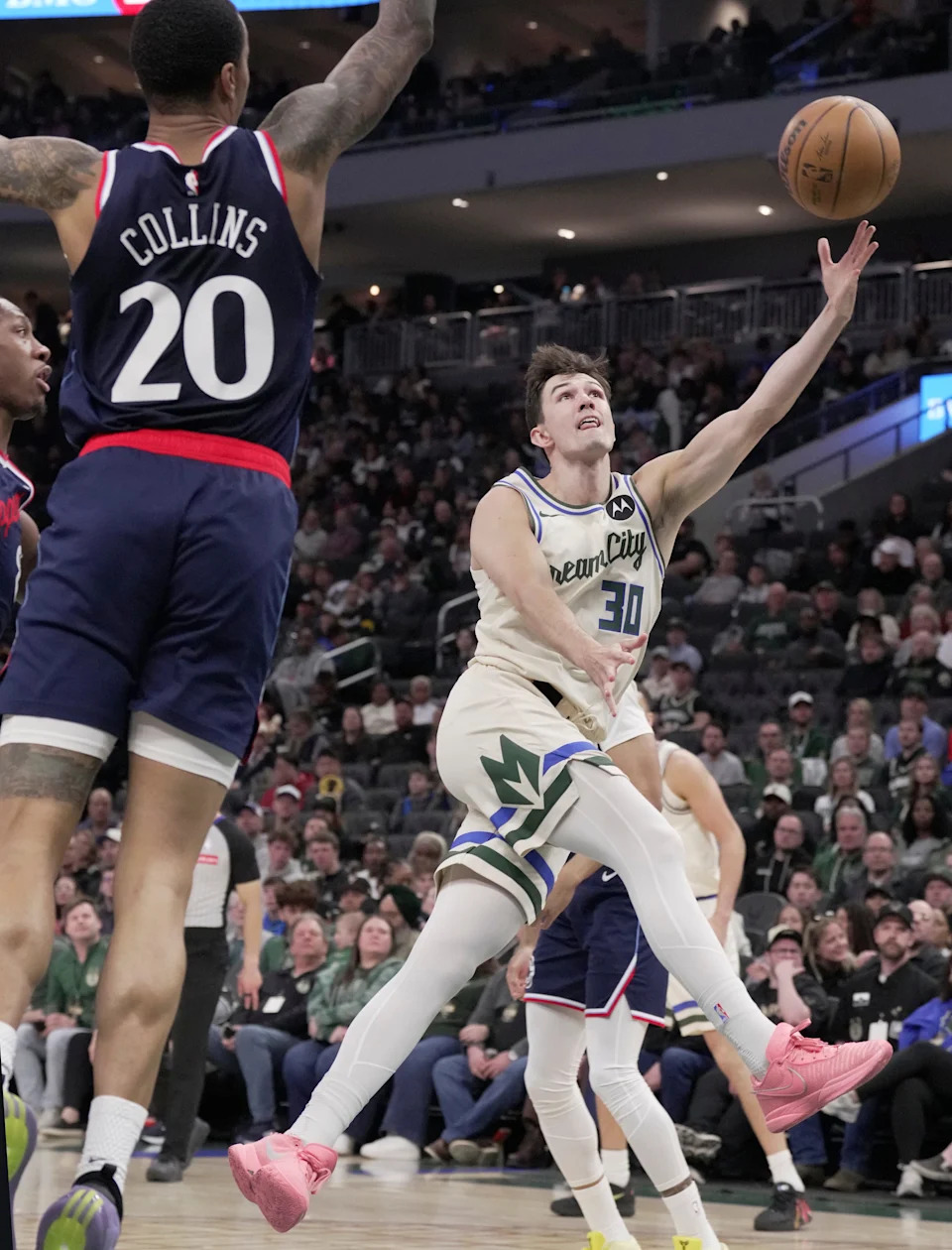 Milwaukee Bucks guard Cormac Ryan (30) scores during the first half of their game against the LA Clippers Sunday, March 29, 2026 at Fiserv Forum in Milwaukee, Wisconsin.