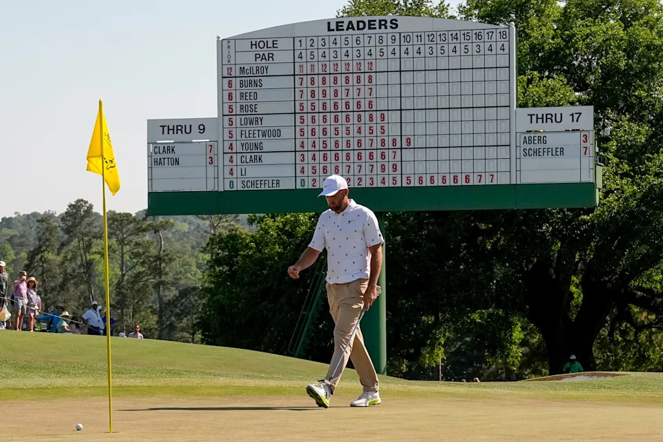 Scottie Scheffler walks to his ball on the 18th hole during the third round of the Masters golf tournament at the Augusta National Golf Club, Saturday, April 11, 2026, in Augusta, Ga. (AP Photo/David J. Phillip)