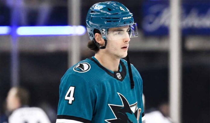 New York Rangers defenseman Braden Schneider pictured in a teal San Jose Sharks uniform, visualizing NHL trade rumors amid NYR rebuild.