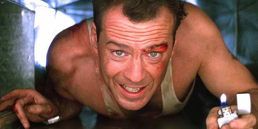 Bruce Willis, playing John McClane, crawls through a duct with a lighter in Die Hard.