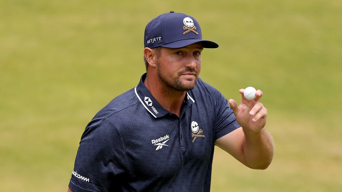 Bryson DeChambeau acknowledges crowd on 18th green at Royal Portrush Golf Club
