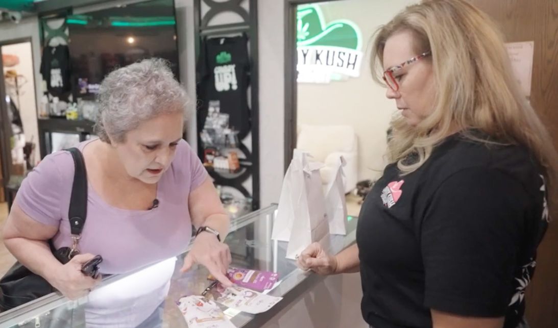 April Ayers, right, advises Brenda Tsukas on which cannabis products are best for the pain relief Tsukas is looking for. Ayers owns Cowboy Kush Dispensary in Broken Arrow, Oklahoma, and says her primary customers are women ages 45 to 60.