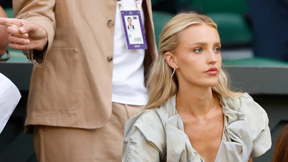 Jul 11, 2025; Wimbledon, United Kingdom; Morgan Riddle, girlfriend of Taylor Fritz (USA)(not pictured), sits in his player's box prior to the match against Carlos Alcaraz (ESP)(not pictured) in a gentlemen's singles semi-final on day twelve of The Championships Wimbledon 2025 at All England Lawn Tennis and Croquet Club. Mandatory Credit: Geoff Burke-Imagn Images