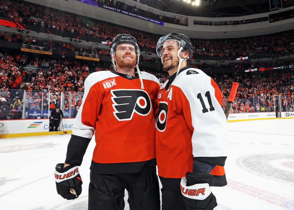 Cam York #8 and Travis Konecny #11 of the Philadelphia Flyers celebrate after defeating the Pittsburgh Penguins 1-0 in overtime in Game 6 of the First Round of the 2026 Stanley Cup Playoffs at the Xfinity Mobile Arena on April 29, 2026 in Philadelphia, Pennsylvania.  