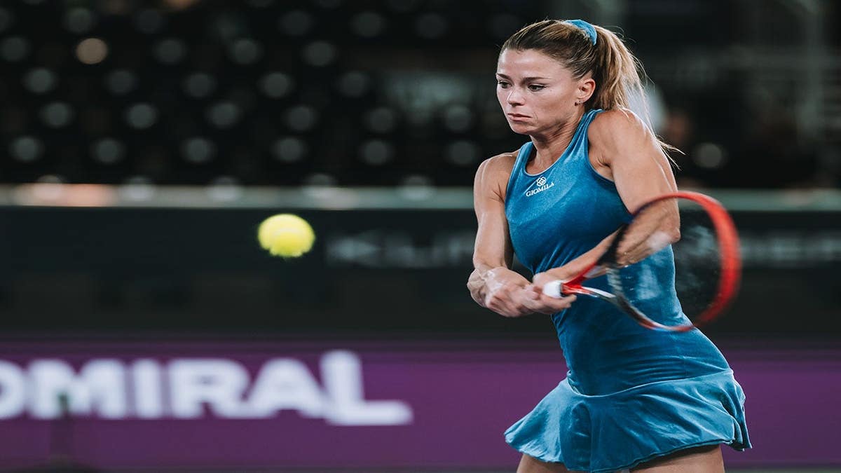 Camila Giorgi hitting a tennis shot during a match in Linz, Austria
