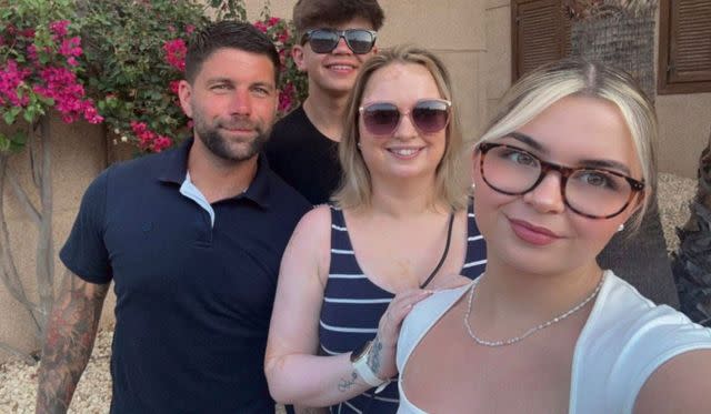 Grant Learmont with his wife and childrenCredit: SWS