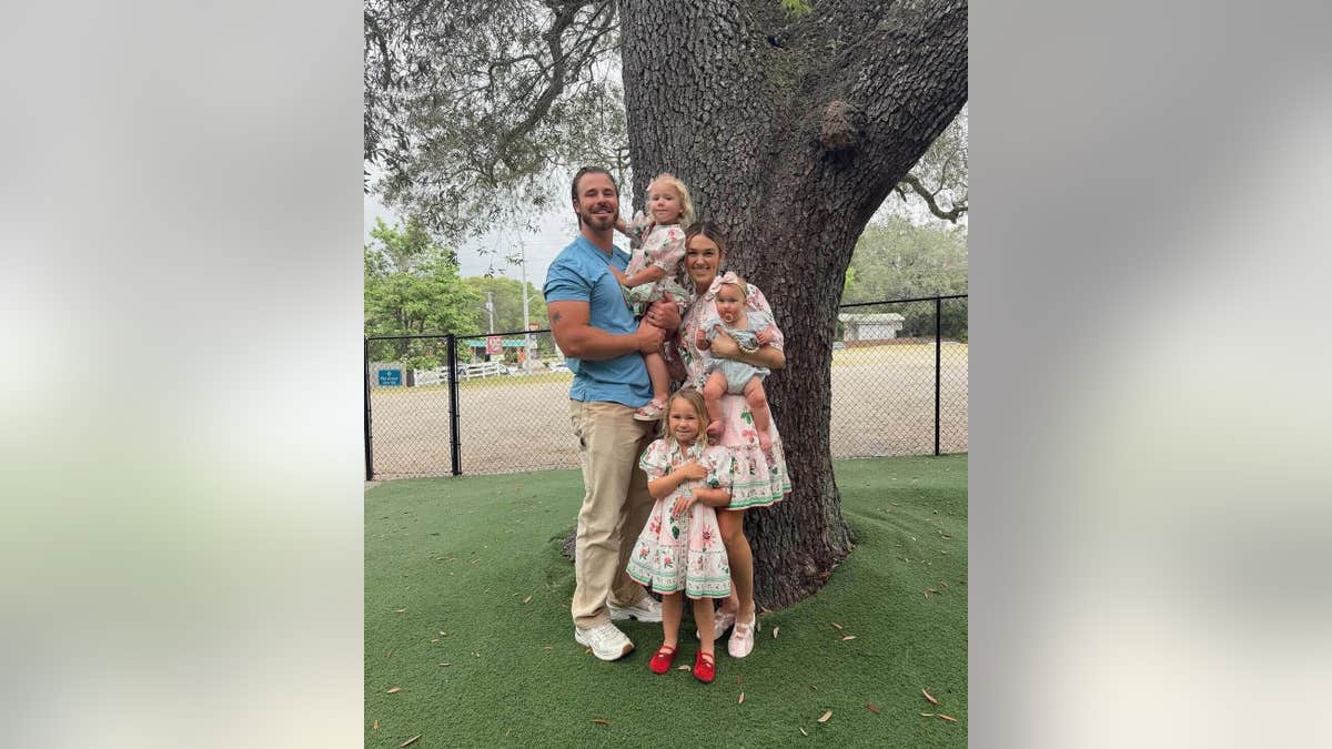 Sadie and Christian posing with their children