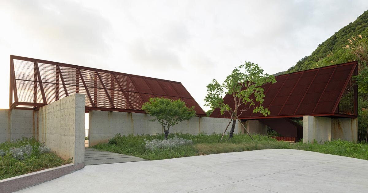 corten-clad twin pavilions frame sea views along chinese coast
