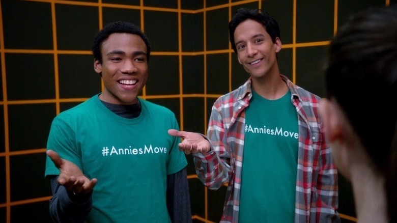 Troy Barnes (Donald Glover) and Abed Nadir (Danny Pudi) smile in the holodeck in Community